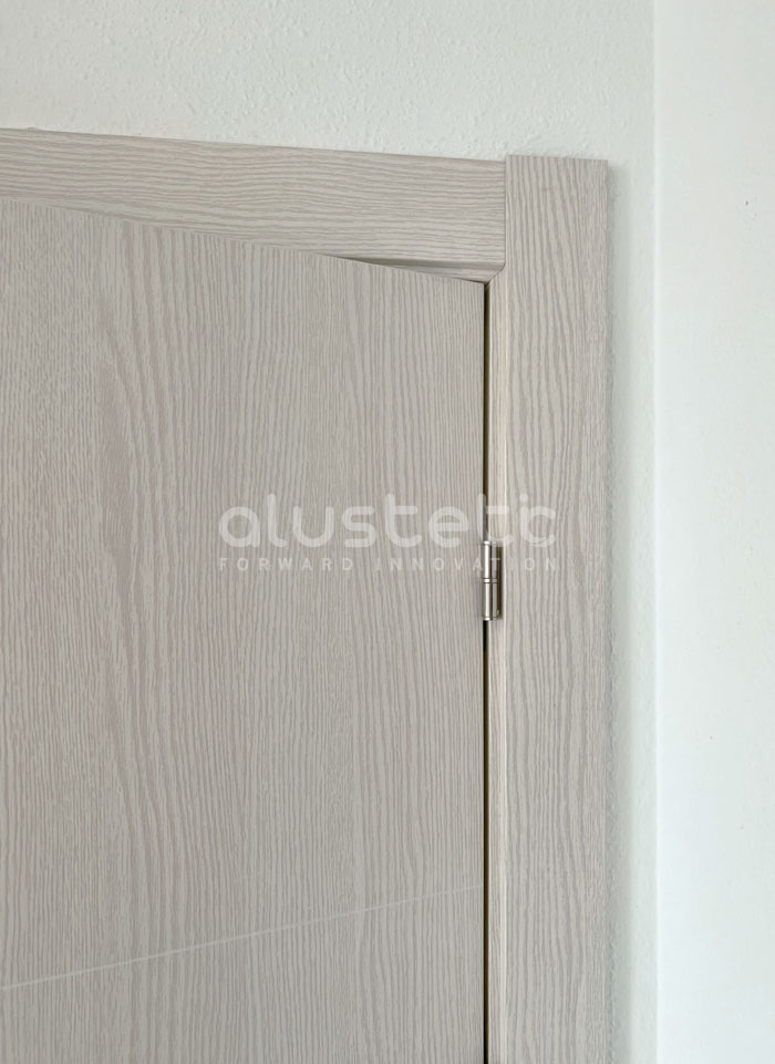 White oak finish aluminium interior door installed in Tarragona