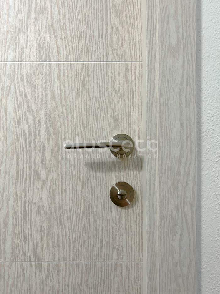 White oak effect aluminium door fitted into the home